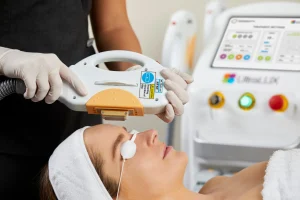 Woman receiving a IPL treatment with protective eye covers.